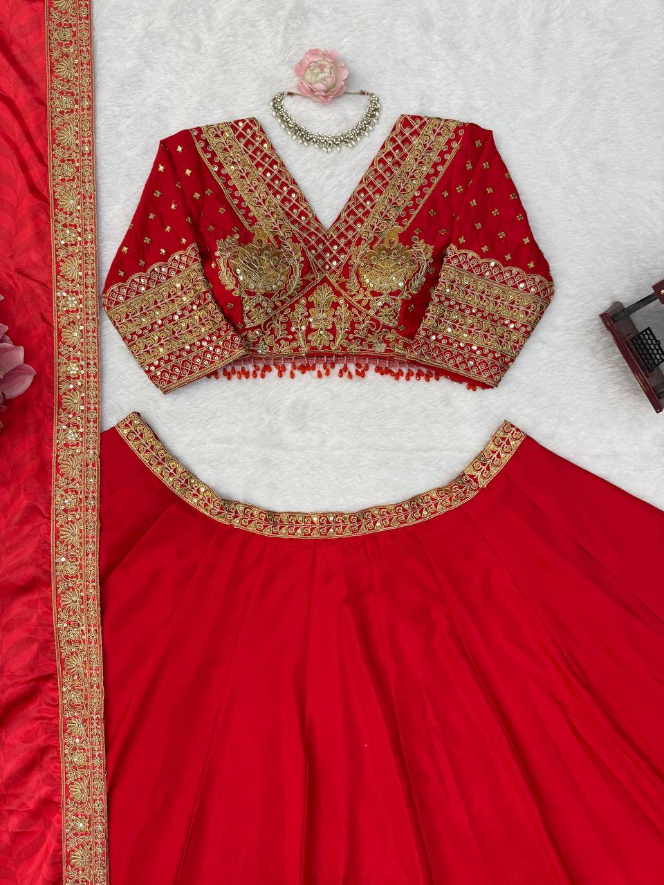 Regal Crimson Red Bridal Lehenga Choli Ensemble Featuring Intricate Gold Zari Embroidery, Heritage Motifs, and Embellished Tassels